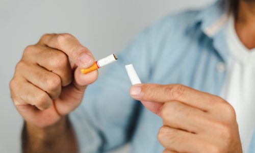 Man hand crushing cigarette, Concept Quitting smoking,World No Tobacco Day.
