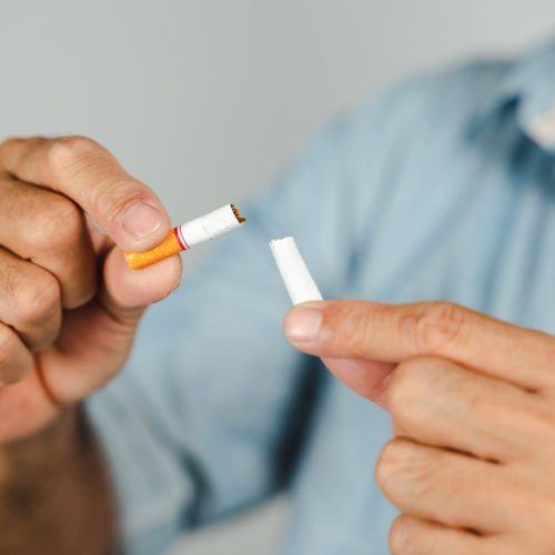 Man hand crushing cigarette, Concept Quitting smoking,World No Tobacco Day.